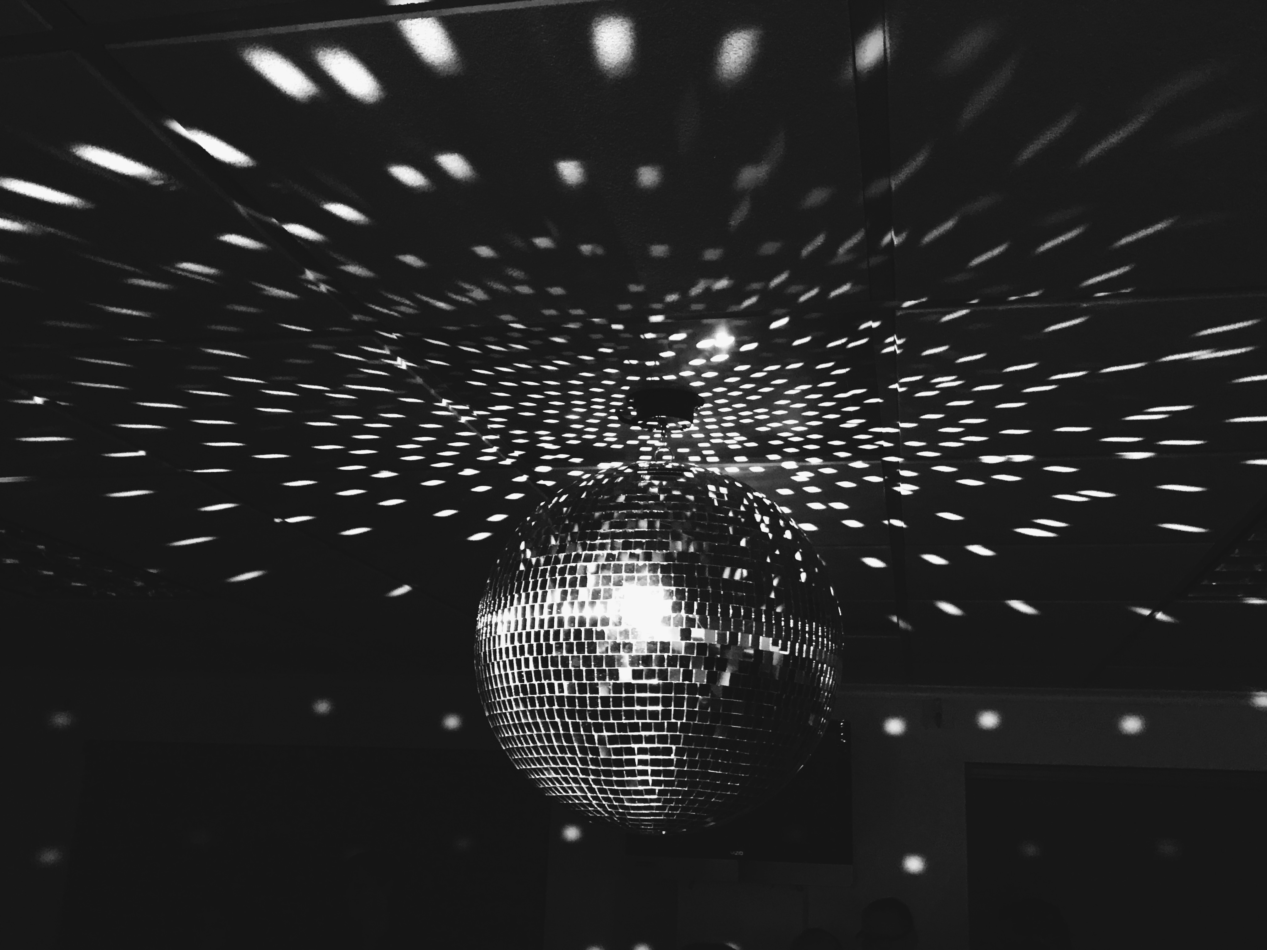 disco ball reflecting light on ceiling